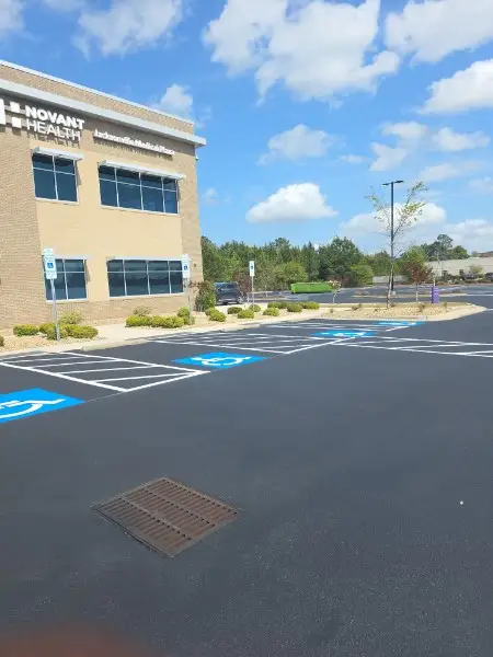 ADA compliant handicap parking stalls and access aisles striped at a Charlotte NC commercial parking lot