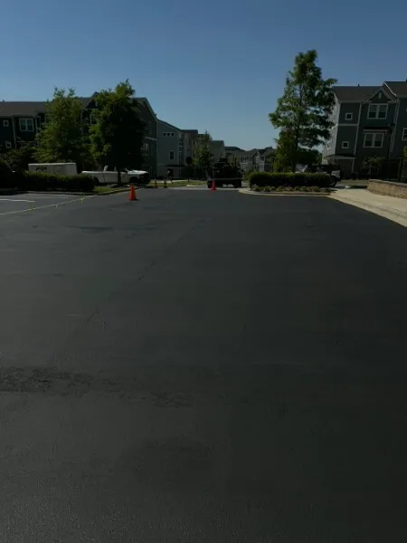 Jet-black sealcoating on a multifamily apartment complex parking lot in Charlotte NC