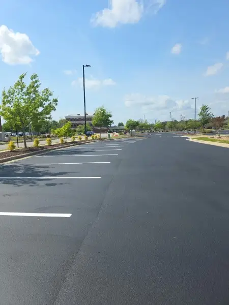 Fresh commercial parking lot sealcoating restoring a jet-black finish in Charlotte NC