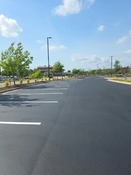 Fresh commercial parking lot sealcoating restoring a jet-black finish in Charlotte NC