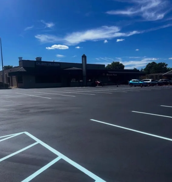 Jet-black sealcoating and crisp white striping at a Charlotte NC retail parking lot