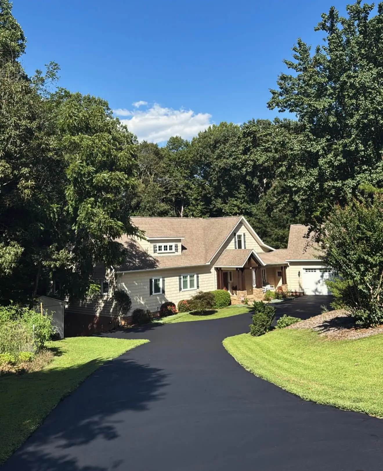 Professional driveway sealcoating services restoring curb appeal on a Charlotte NC home