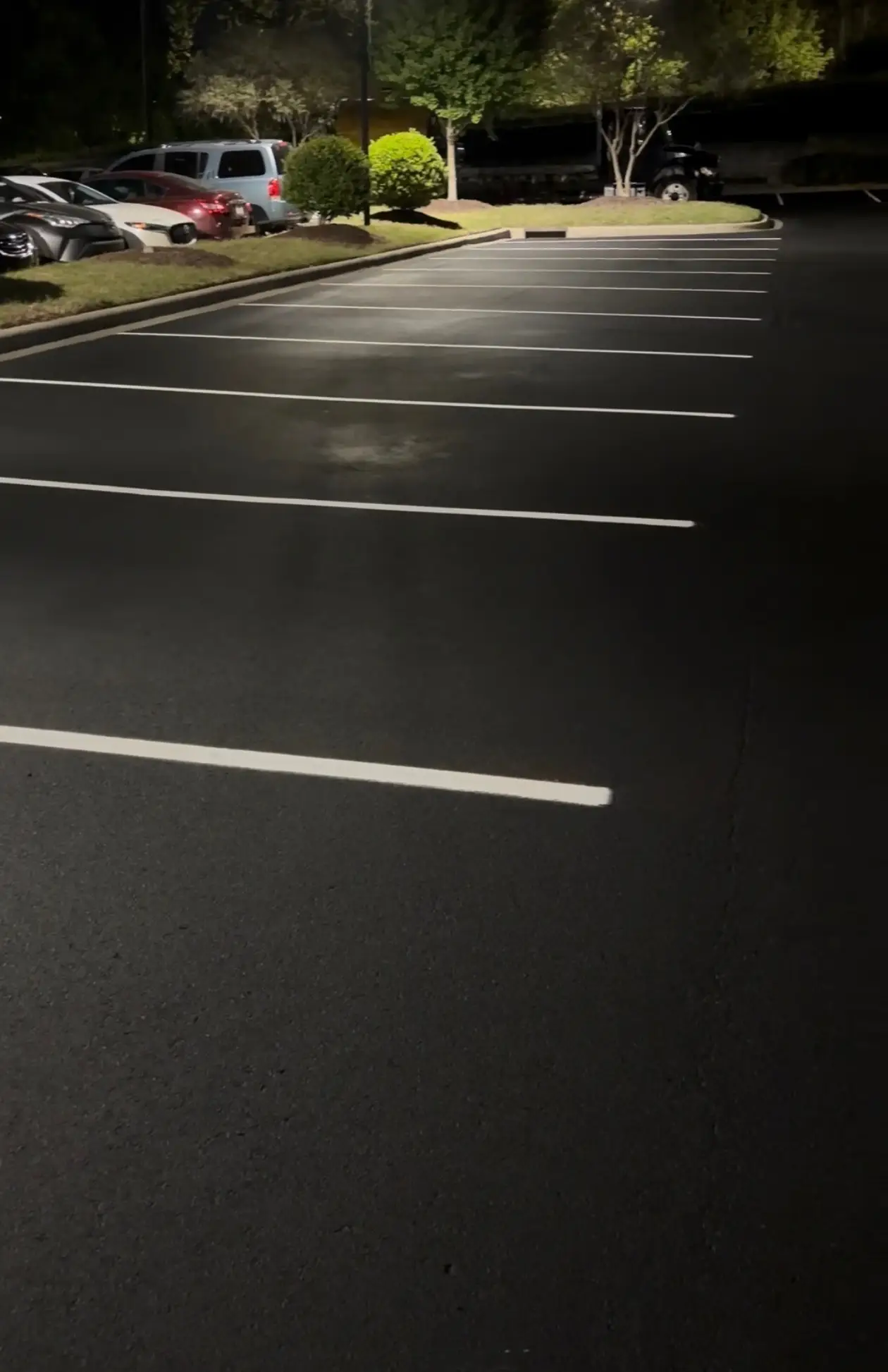 Reflective parking lot striping paint improving nighttime visibility at a Charlotte NC retail center