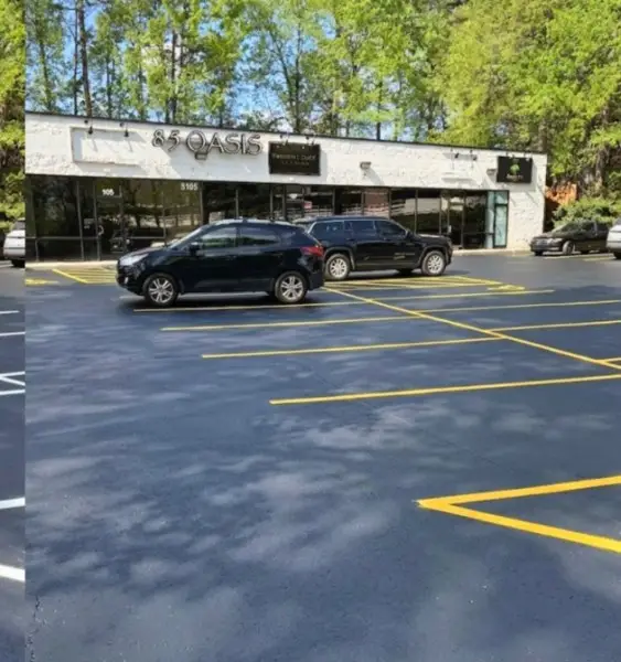 Retail parking lot striping with bright yellow lines at a Charlotte NC shopping center